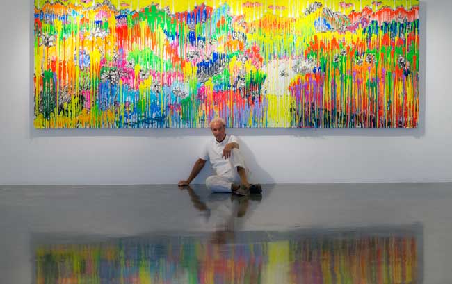 Tom Everhart in front of painting in his Venice Studio