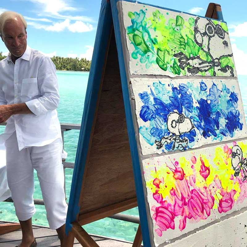 Tom Everhart paints partly Cloudy. Snoopy as the flying ace in the skys of Tahiti 